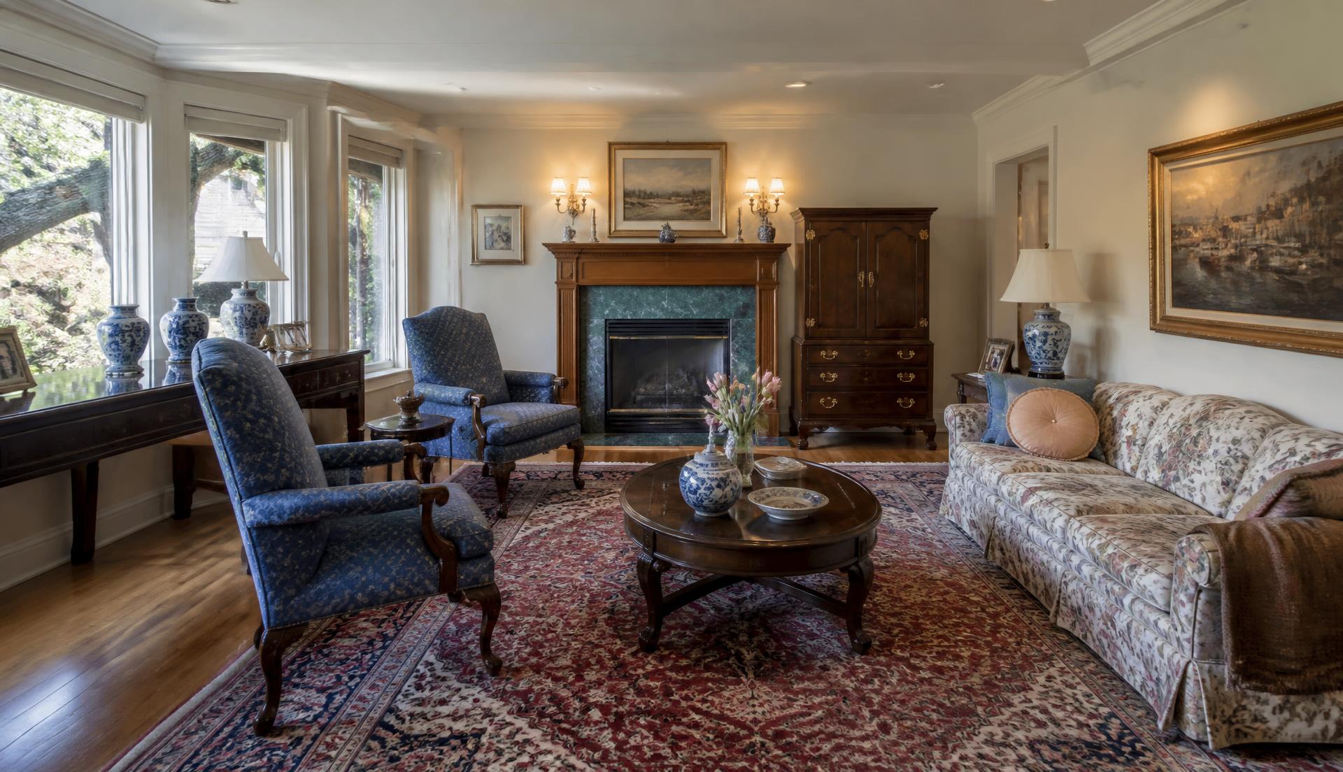 Antique furniture and porcelain staged in a South Sound living room for an estate sale